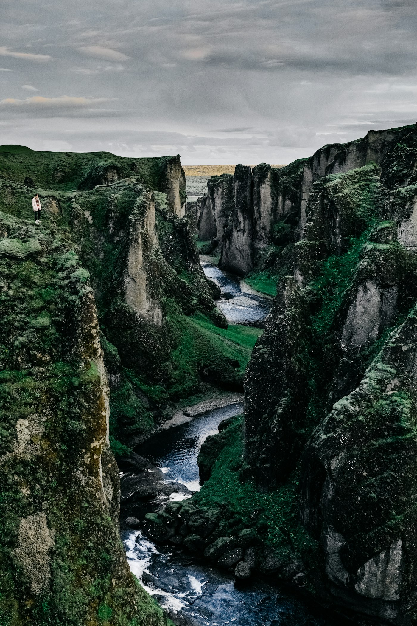Lush green canyon with a waterfall